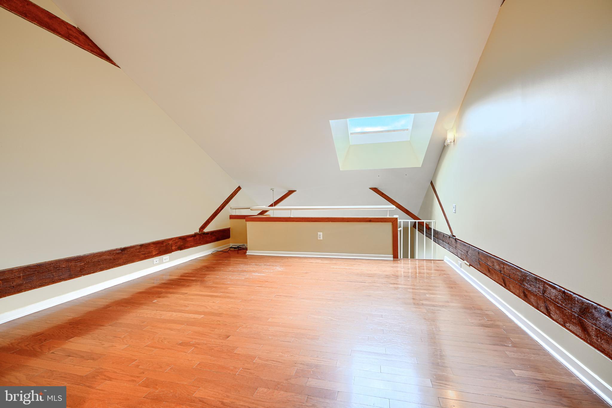 2639 Boston Street, Unit 305 Baltimore, MD 21224 - Photo 15 of 21 a view of a hallway with staircase