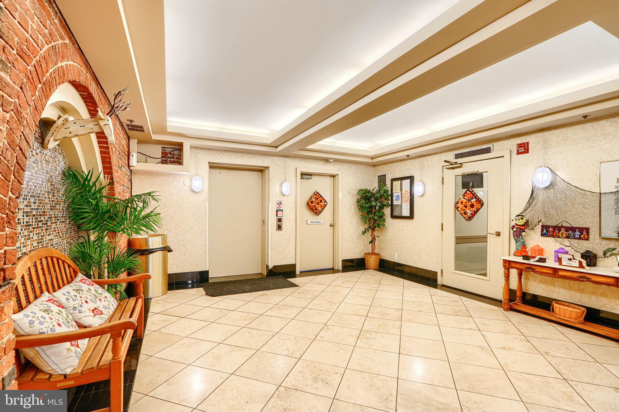 2639 Boston Street, Unit 305 Baltimore, MD 21224 - Photo 2 of 21 a view of an entryway with wooden floor