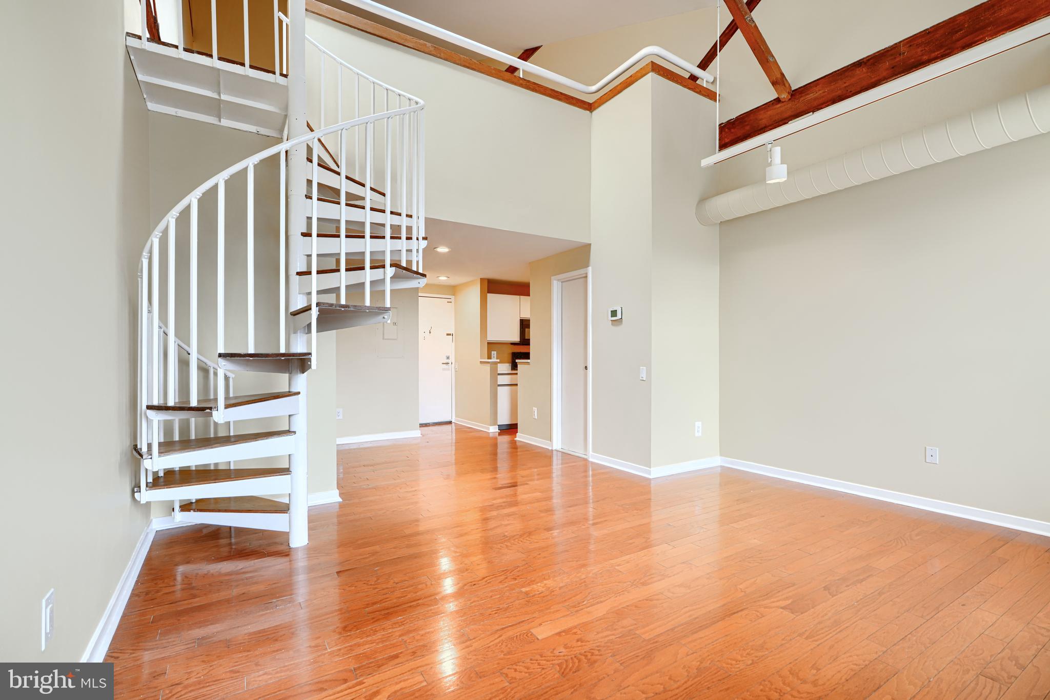 2639 Boston Street, Unit 305 Baltimore, MD 21224 - Photo 9 of 21 a view of entryway and hall with wooden floor