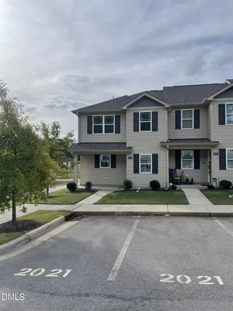 a view of multiple houses with a yard