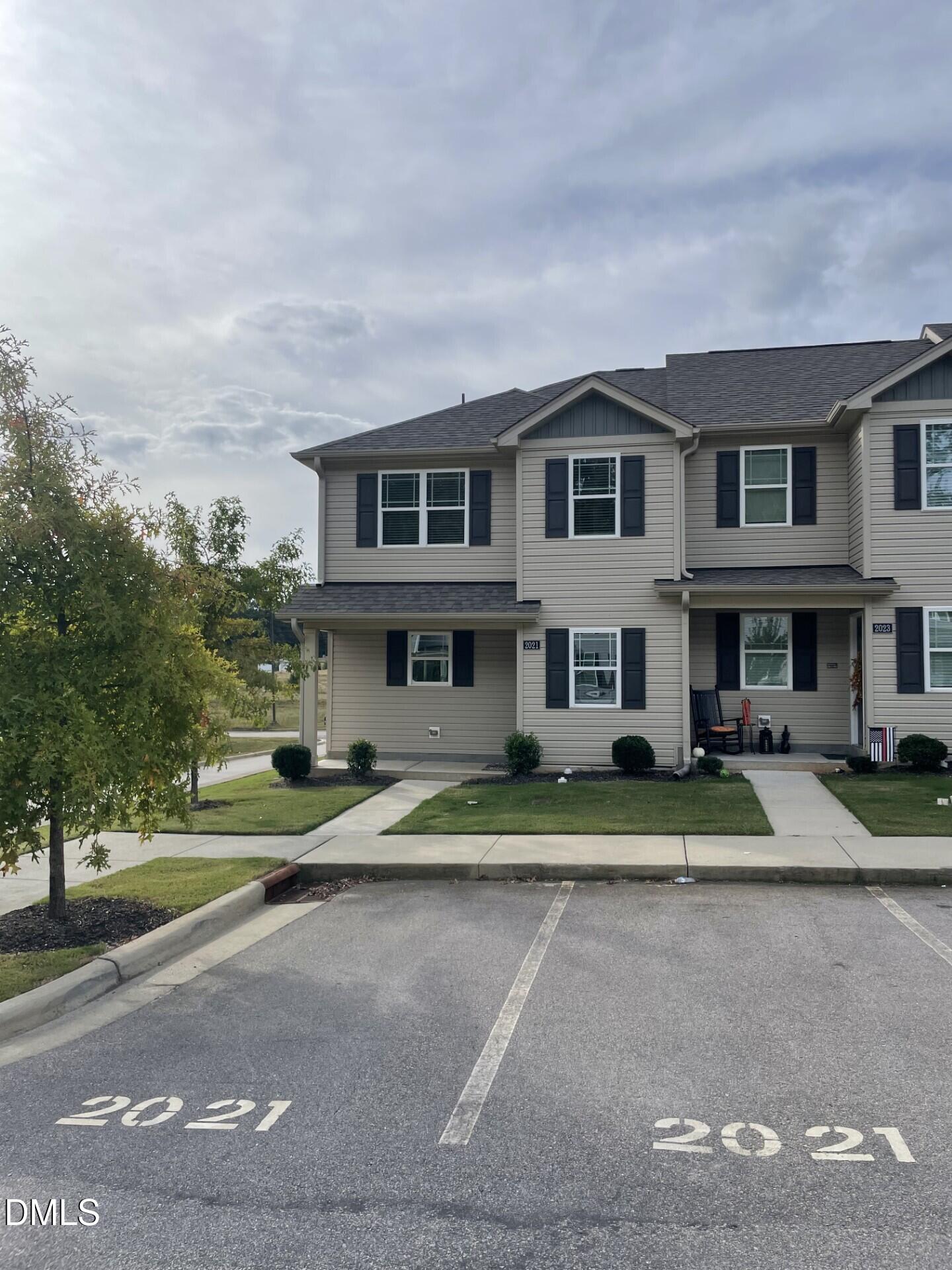 a view of multiple houses with a yard