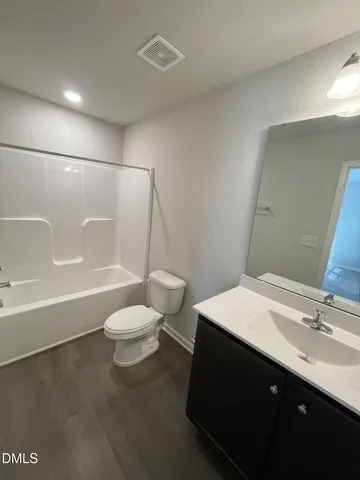 an empty room with a mirror