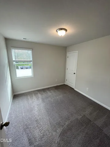 a bathroom with a double vanity sink and mirror with shower