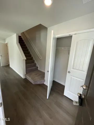 a kitchen with wooden cabinets and sink