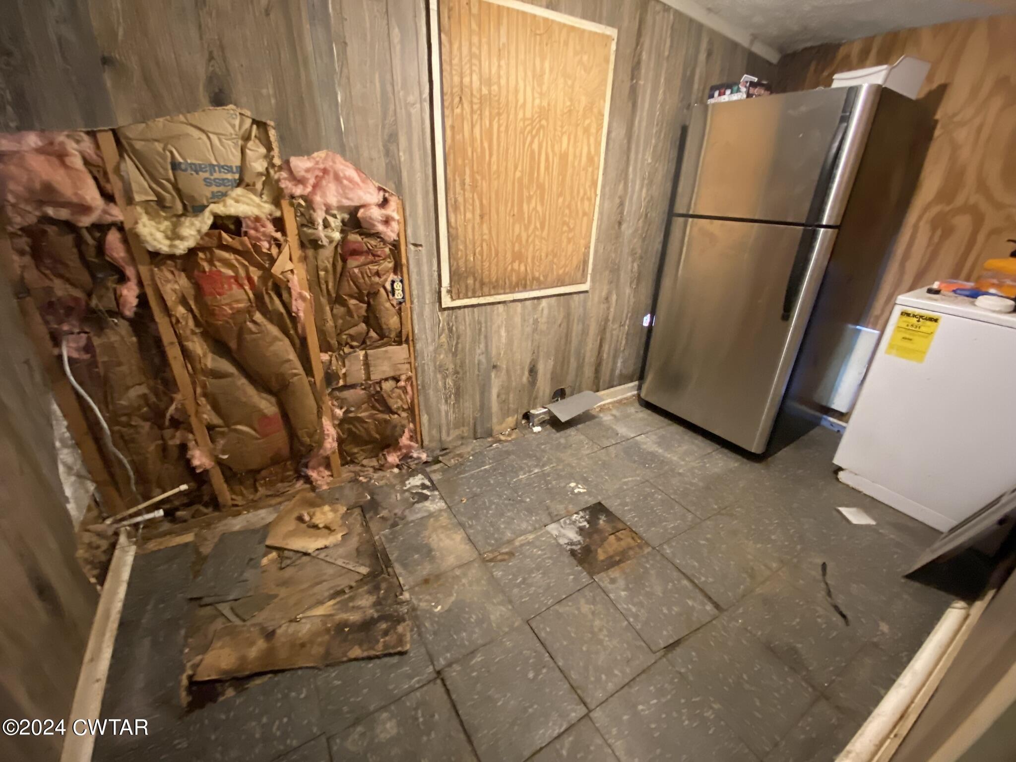 2160 Jones Road Luray, TN 38352 - Photo 6 of 8 a view of a refrigerator in a kitchen