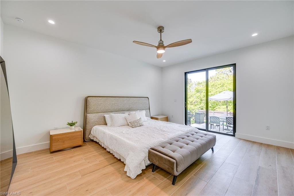 3384 Canal Street Naples, FL 34112 - Photo 16 of 34 Bedroom featuring recessed lighting, light wood-type flooring, access to exterior, and a ceiling fan