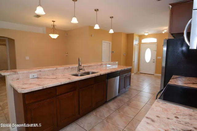 a bathroom with a sink double vanity and a mirror