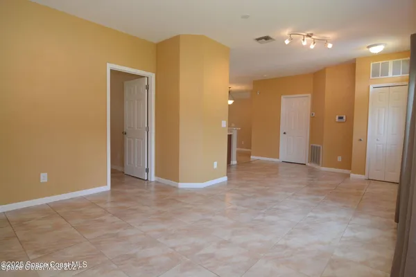 a view of an empty room with a bathroom