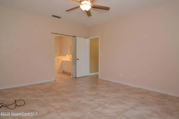 a view of an empty room with a bathroom