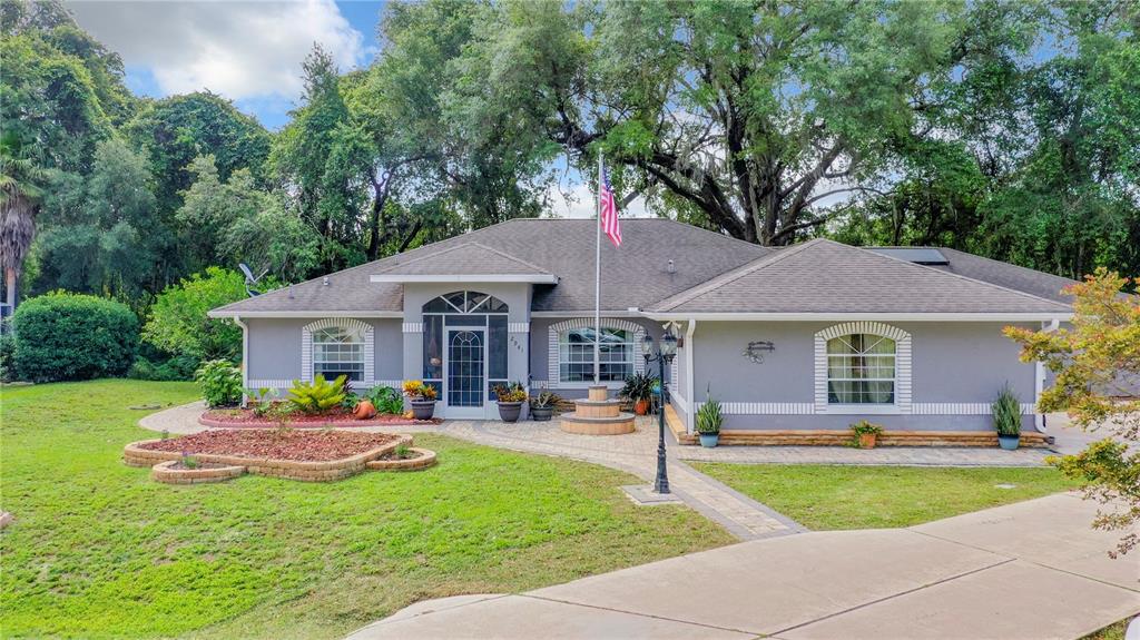 a front view of house with yard and outdoor seating