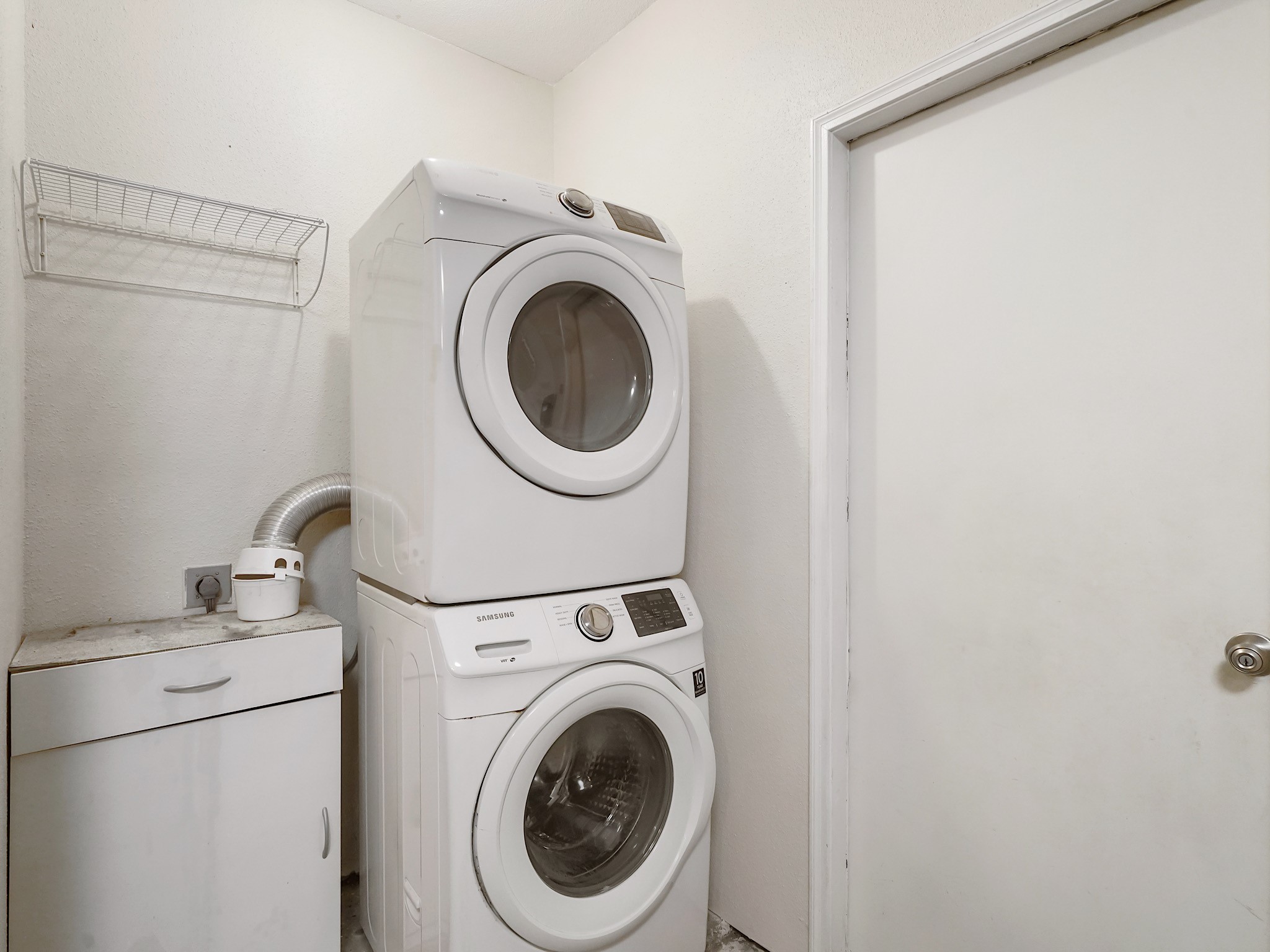 6000 Reims Road, Unit 2205 Houston, TX 77036 - Photo 27 of 35 Convenient in-home laundry room.