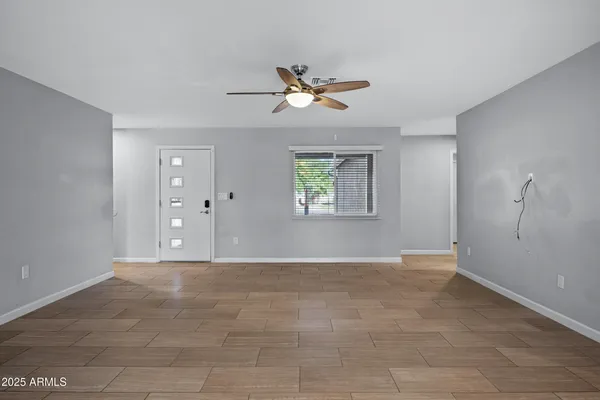 a view of an empty room with a window