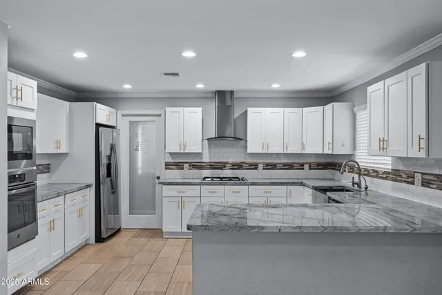 a kitchen with a refrigerator sink and stove