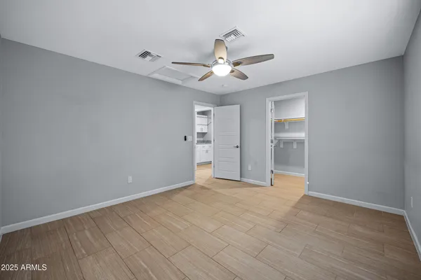 a view of an empty room with a window