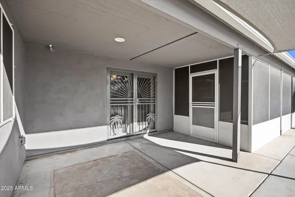 a view of an empty room with sliding glass door