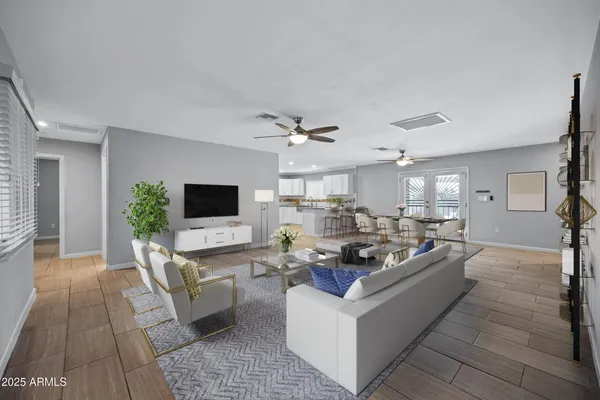 a living room with furniture flat screen tv and a fireplace