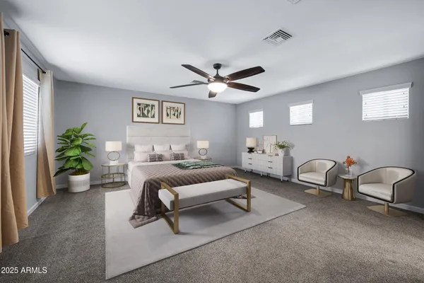 a living room with furniture and a ceiling fan