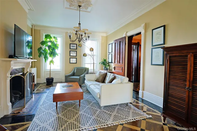 a living room with furniture and a fireplace
