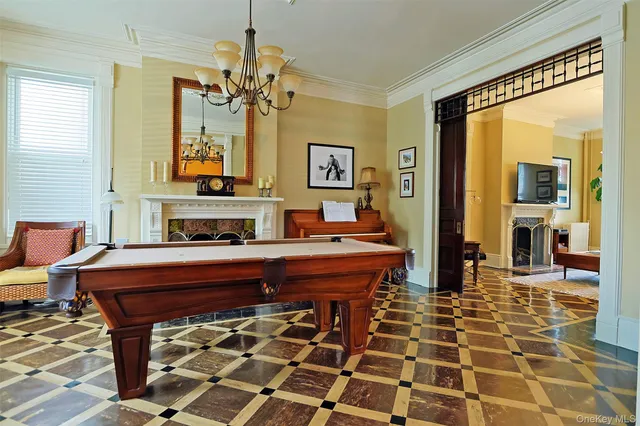 a dining room with furniture and window