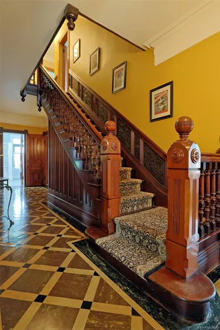 a hallway with a black white checkered floor
