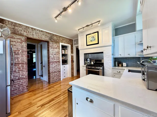 a view of balcony with wooden floor