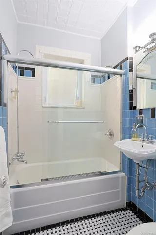 a bedroom with a bed and a shower