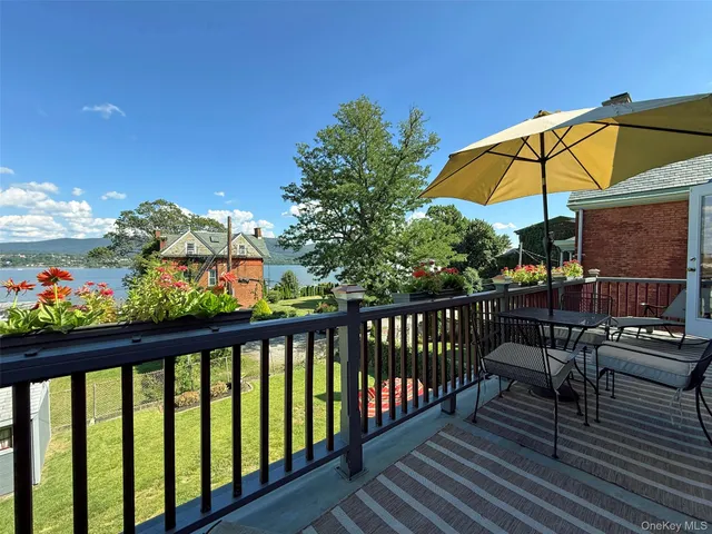 a view of a balcony with chairs