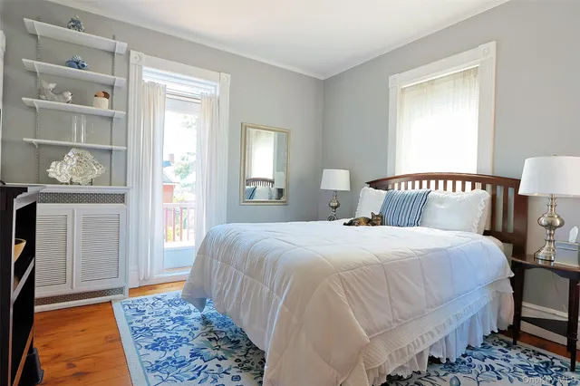 a view of a hardwood floor and staircase in a room