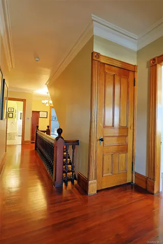 a living room with furniture a dining table and wooden floor