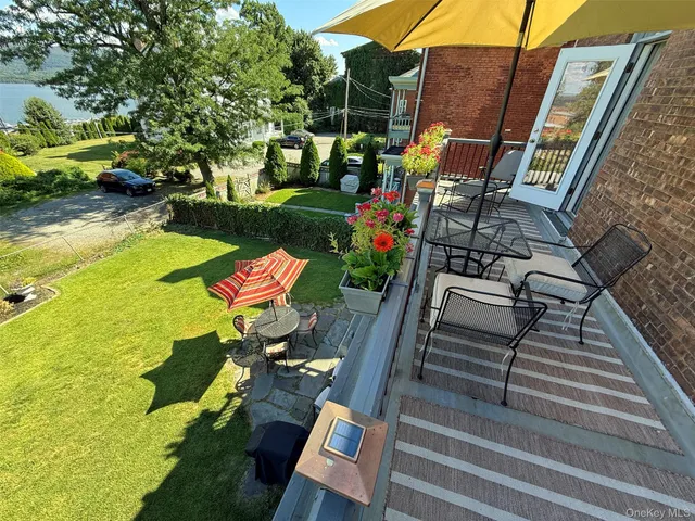 a backyard of a house with outdoor seating
