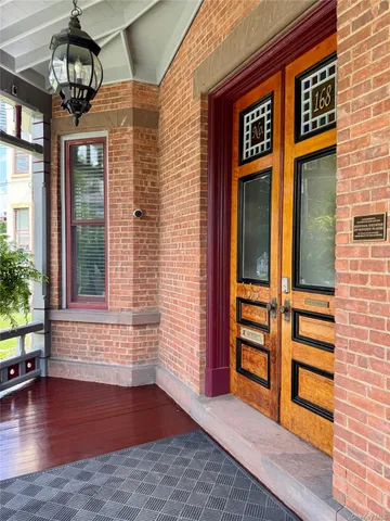 a view of front door of house with stairs