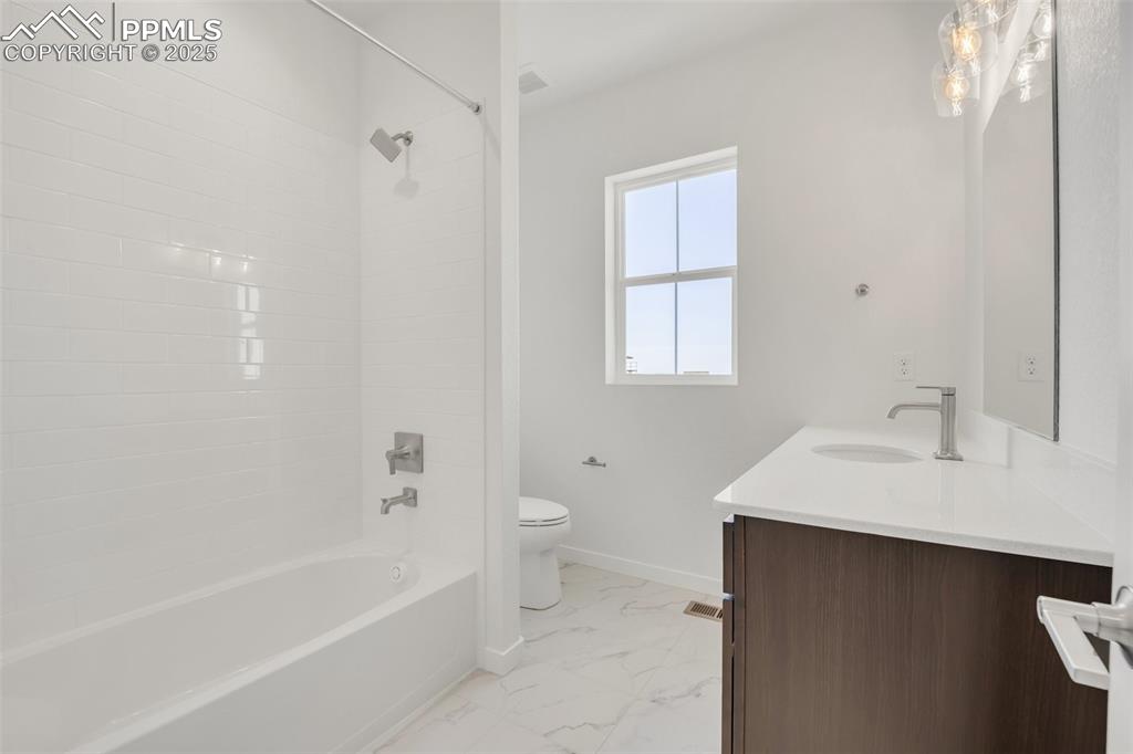 8156 Manor House Way Colorado Springs, CO 80908 - Photo 17 of 35 a bathroom with a sink toilet tub and shower