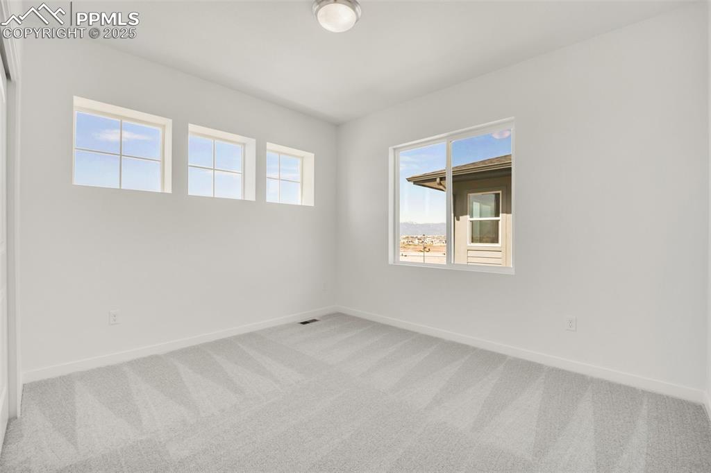 8156 Manor House Way Colorado Springs, CO 80908 - Photo 19 of 35 an empty room with a window