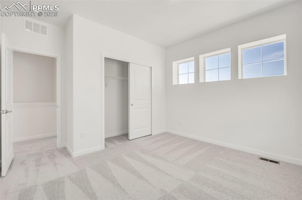 8156 Manor House Way Colorado Springs, CO 80908 - Photo 20 of 35 a view of an empty room with window