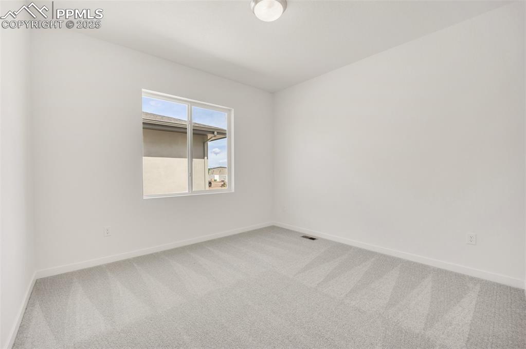 8156 Manor House Way Colorado Springs, CO 80908 - Photo 25 of 35 an empty room with a window