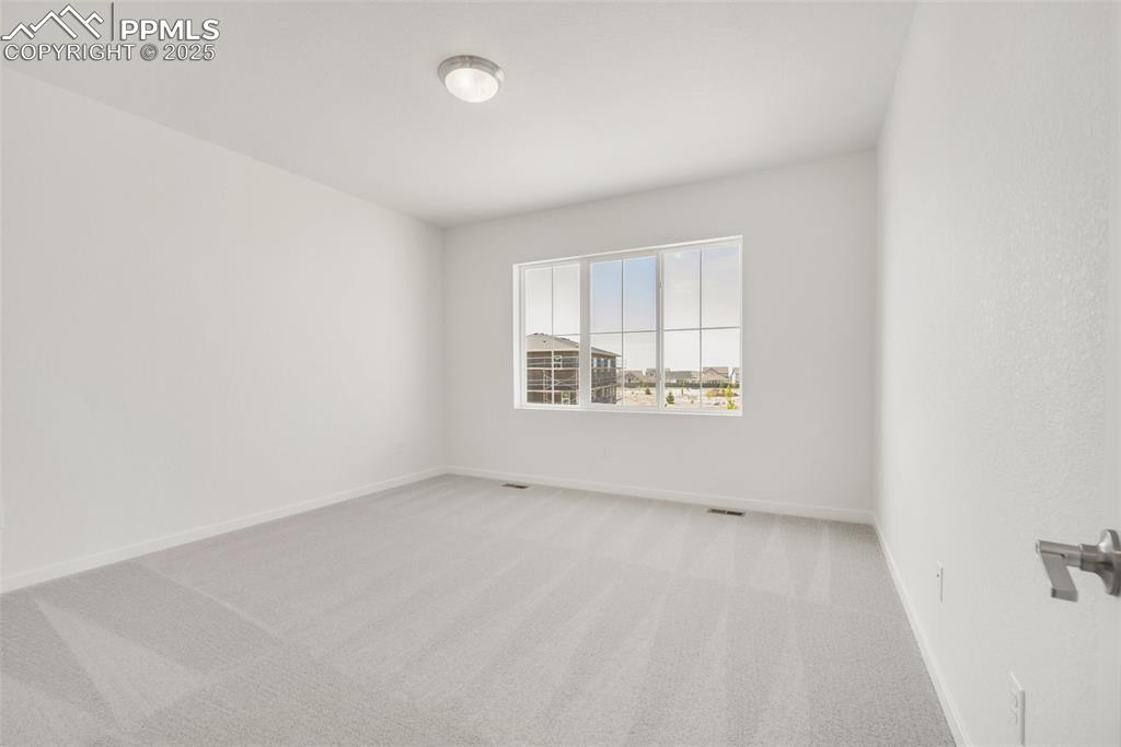 8156 Manor House Way Colorado Springs, CO 80908 - Photo 28 of 35 an empty room with a window