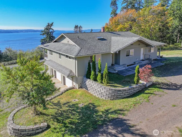 a front view of a house with a yard fountain and a fountain