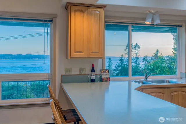 a view of a living room and floor to ceiling window