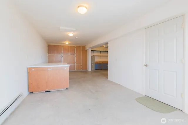 a view of an empty room with a cabinet