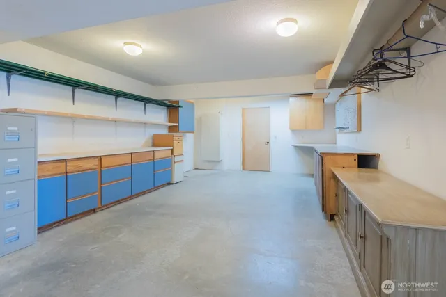 a kitchen with stainless steel appliances a sink and cabinets
