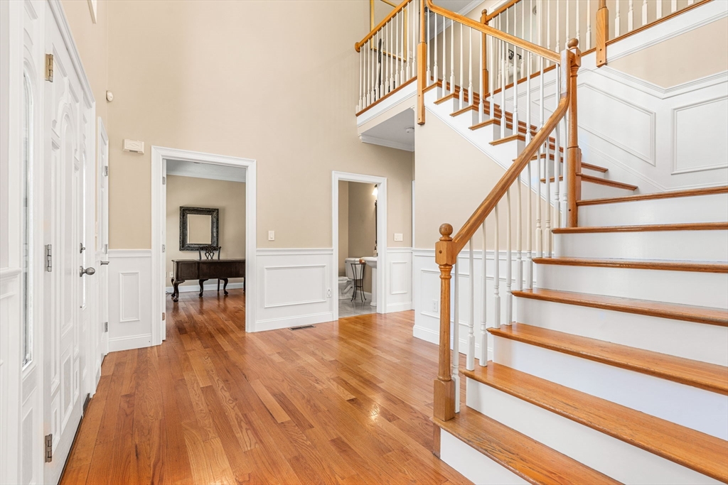 10 Sawyer Lane Middleton, MA 01949 - Photo 11 of 46 a view of entryway and hall with wooden floor