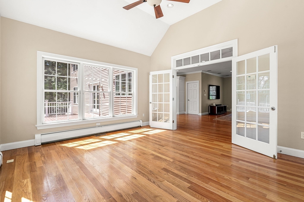 10 Sawyer Lane Middleton, MA 01949 - Photo 23 of 46 an empty room with wooden floor and windows