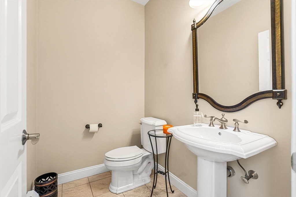 10 Sawyer Lane Middleton, MA 01949 - Photo 27 of 46 a bathroom with a sink a toilet and mirror