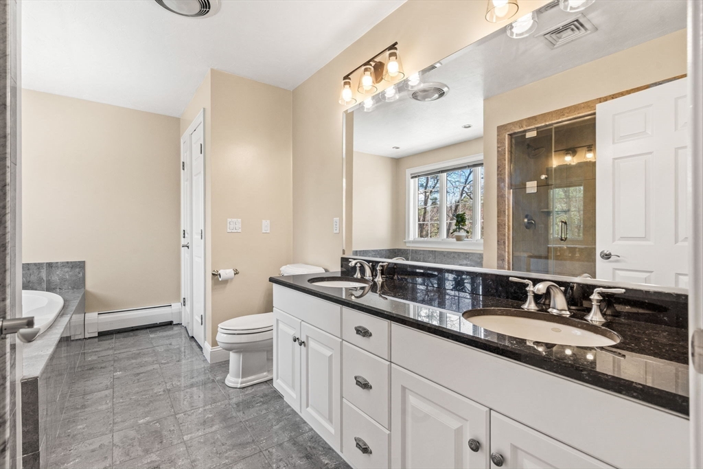 10 Sawyer Lane Middleton, MA 01949 - Photo 29 of 46 a bathroom with a granite countertop double vanity sink a mirror and a toilet