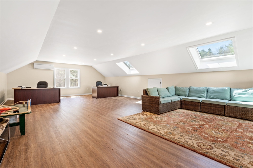 10 Sawyer Lane Middleton, MA 01949 - Photo 40 of 46 a living room with furniture and a wooden floor