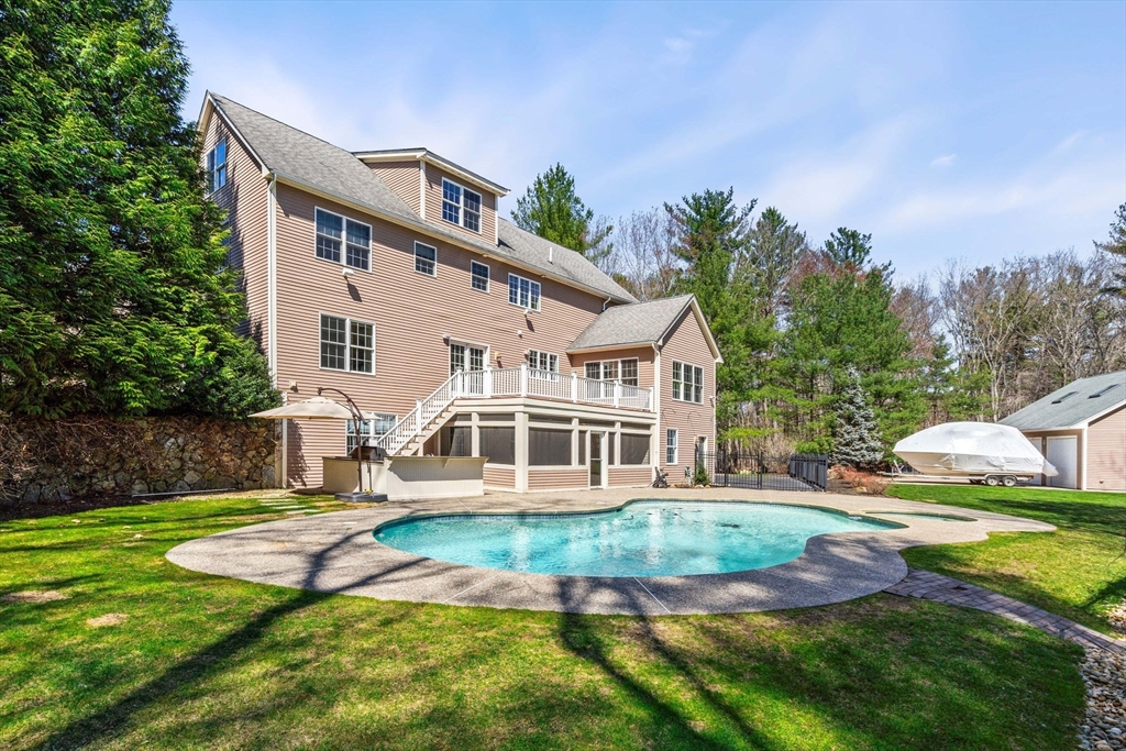 10 Sawyer Lane Middleton, MA 01949 - Photo 4 of 46 a front view of a house with a yard