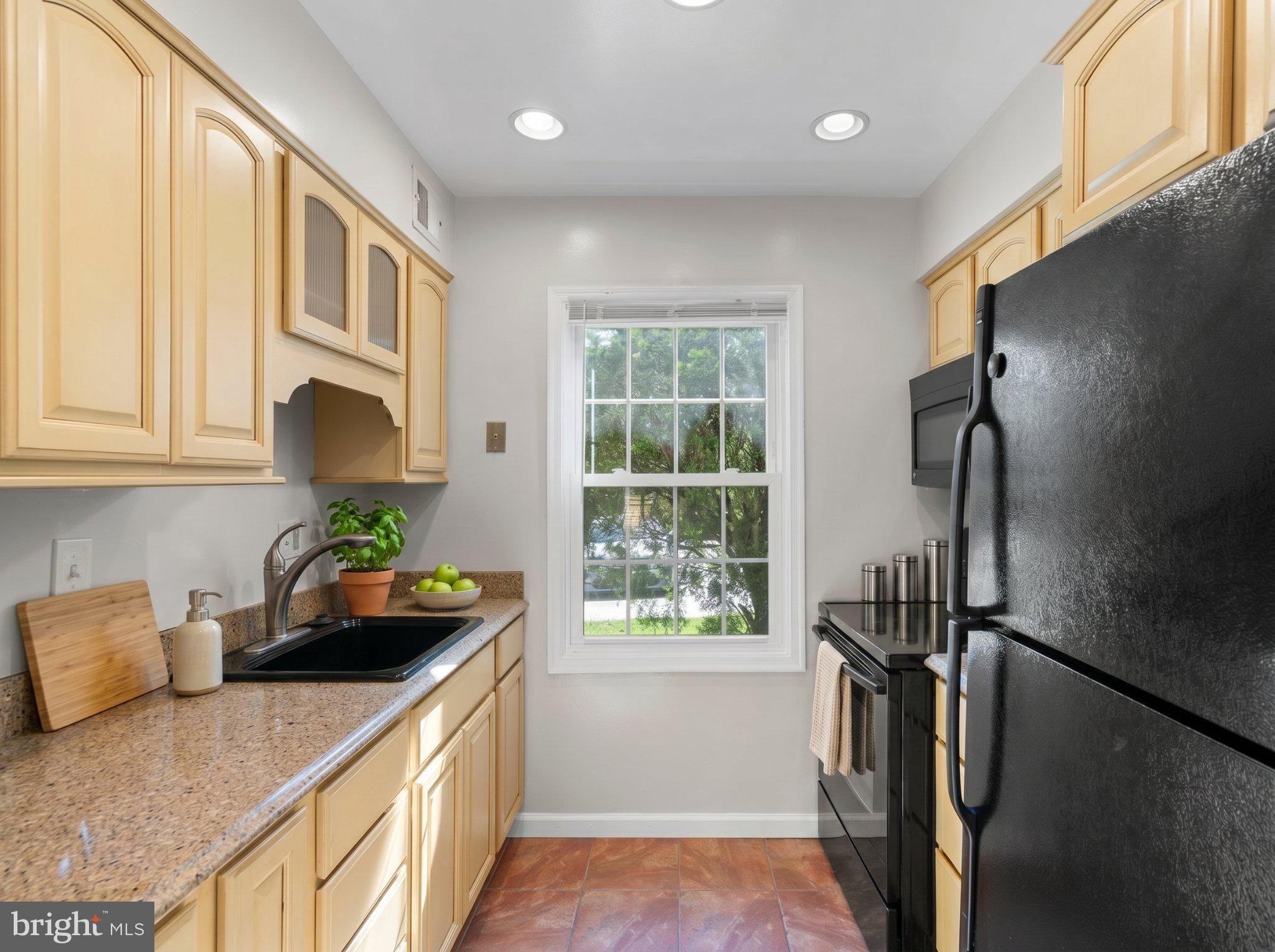 8221 Tory Road, Unit 150 Springfield, VA 22152 - Photo 14 of 36 Bright and inviting kitchen space.