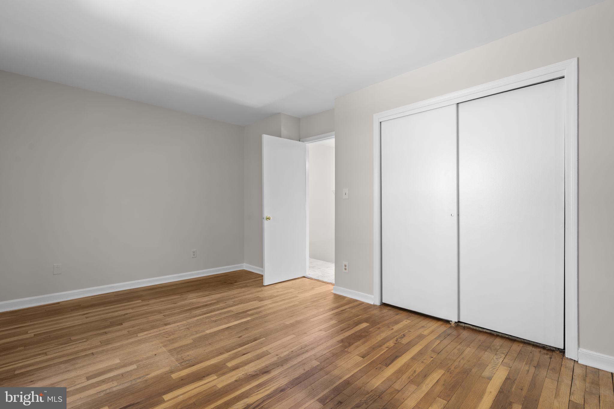 8221 Tory Road, Unit 150 Springfield, VA 22152 - Photo 26 of 36 Spacious room with warm wood floors.