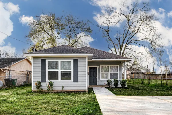 front view of a house with a yard