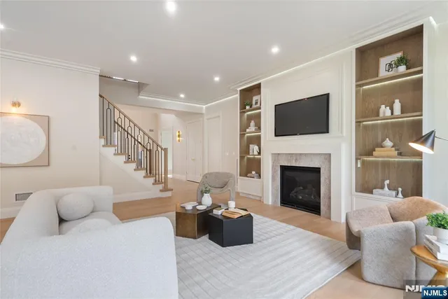 a living room with furniture fireplace and flat screen tv